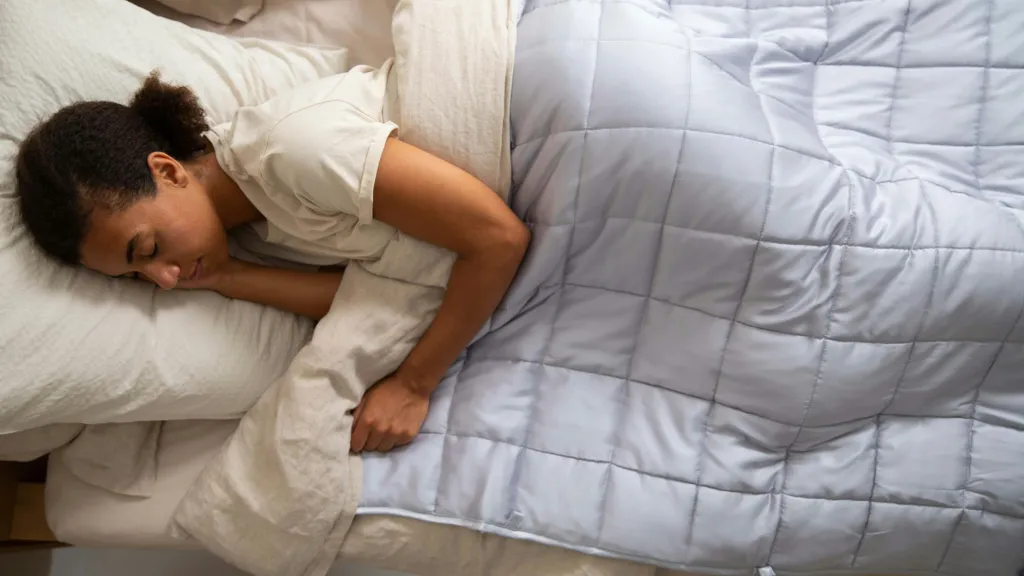 Woman sleeping in a bed – Benefits of napping